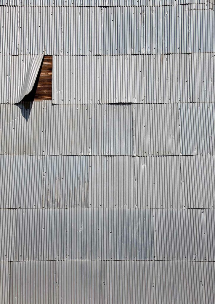 corrugated shingles on a wooden wall