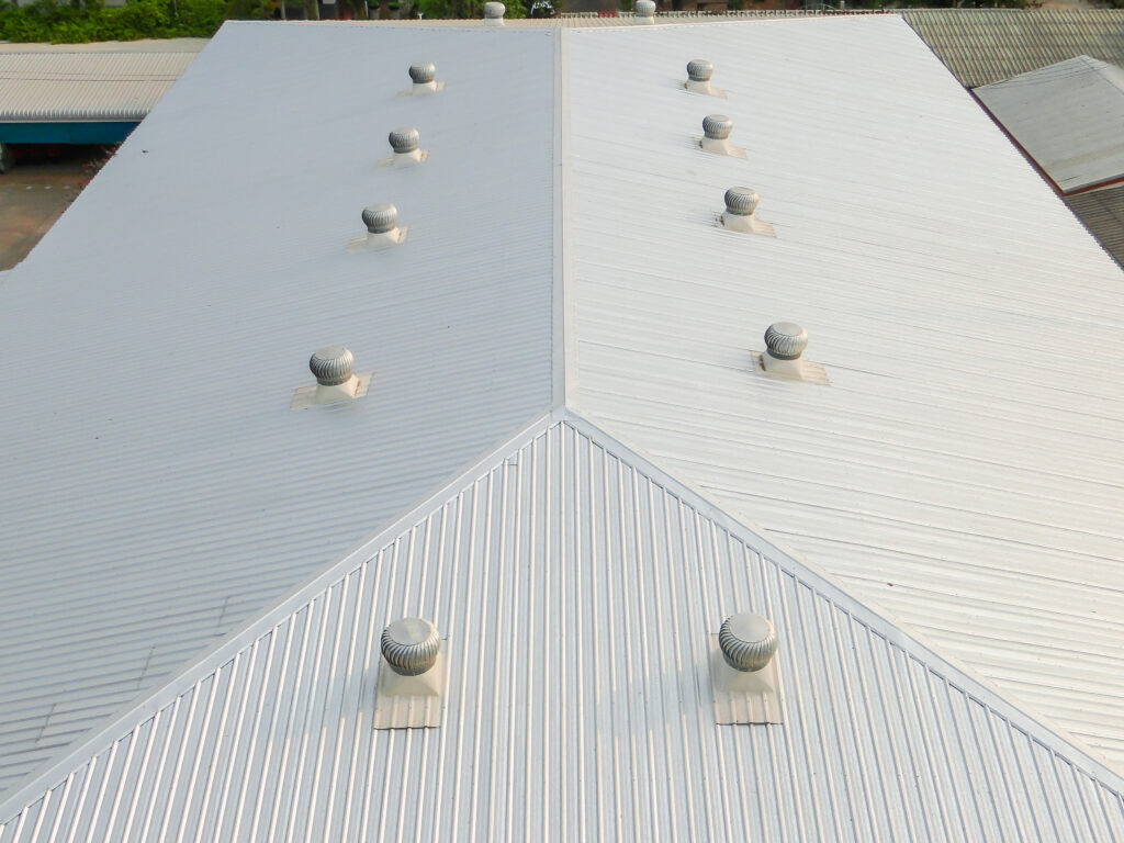 metal sheet roofing on commercial construction with blue sky