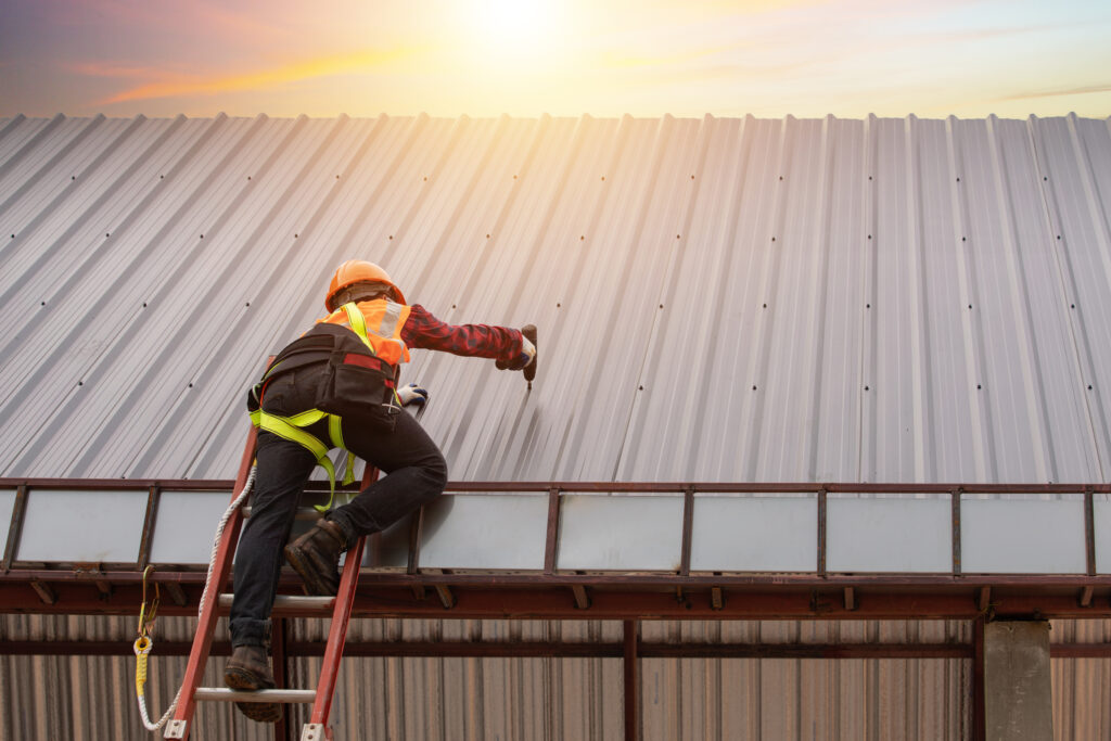 commercial metal roofing worker